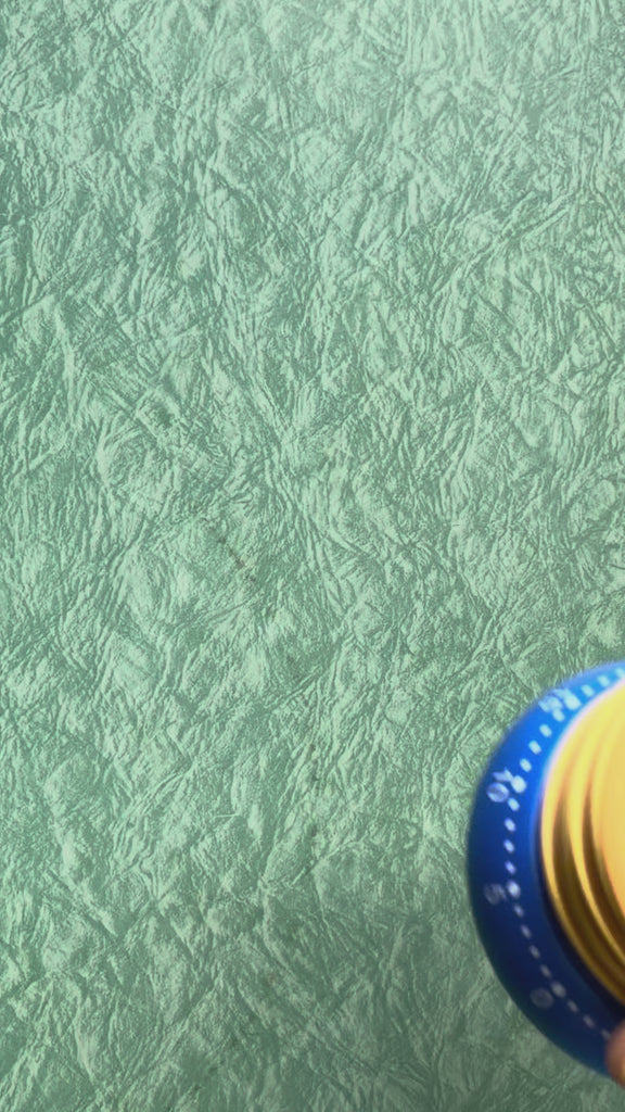 model using pancake shaped kitchen timer with smiley face