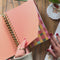 model flipping through medium 17-month planner