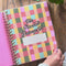 model flipping through 17-month planner