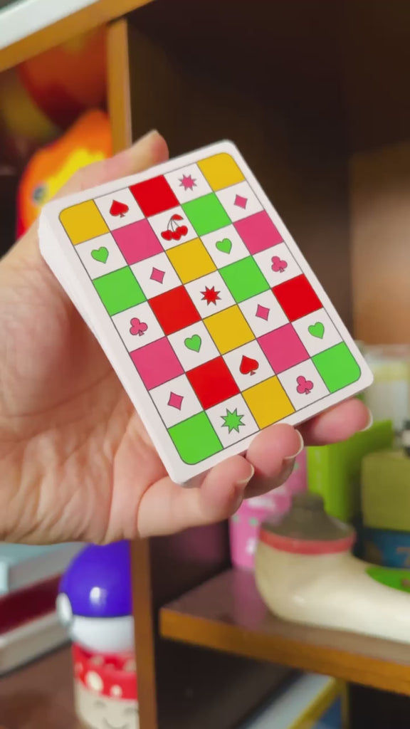 model showing off waterproof playing cards