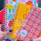 model showing colorful planners in classic, medium and large sizes
