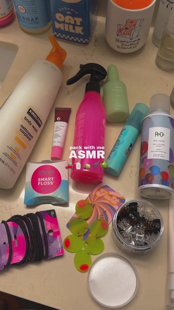 model packing toiletries in pink 'squeaky clean' travel set