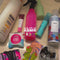 model packing toiletries in pink 'squeaky clean' travel set