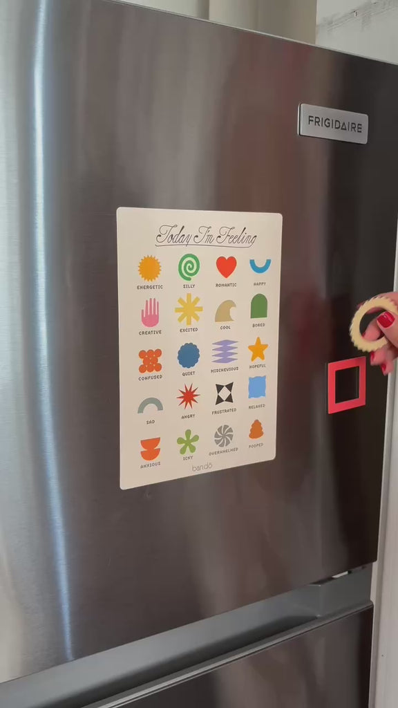 model putting magnet on mood tracker