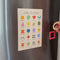 model putting magnet on mood tracker