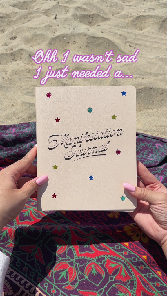 model flipping through manifestation journal