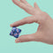 model holding various shades of blue mini magnet fidget toy 