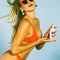 model holding SPF 30 whipped classic sunscreen in a whip cream type can